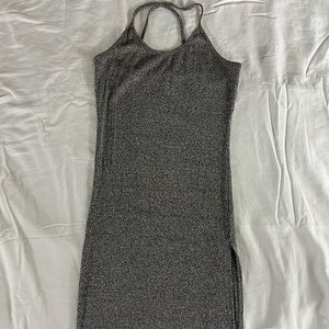 Poetry mini dress. Grey. Figure hugging. Cross spaghetti straps. Front leg slit.